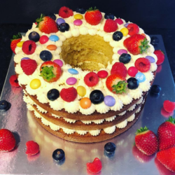 Vanilla Cake topped with Berries and Smarties